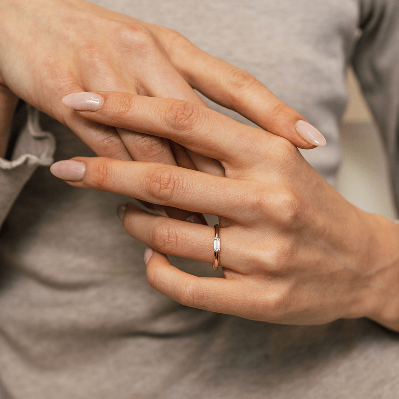 Rounded 14k gold band with a petite baguette diamond