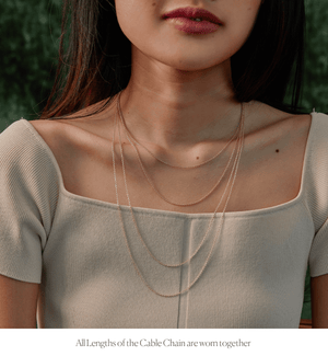 Model wearing all lengths of the 14k gold cable chain necklace 