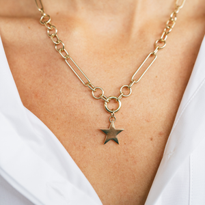 Model wearing the 14k solid gold engravable star charm on the Mixed Link Charm Clip Necklace