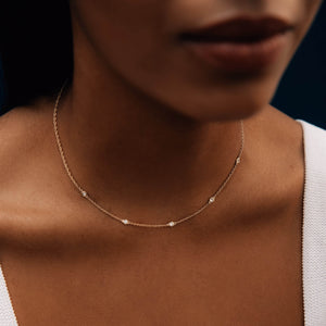 Model wearing 14k gold chain with diamonds 