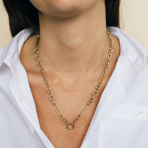 Model wearing chunky mixed link 14k gold charm necklace 