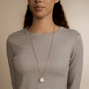 Model wearing the 14k gold link chain necklace with the Classic Circle Charm