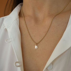 Model wearing 14k solid gold letter "B" charm 