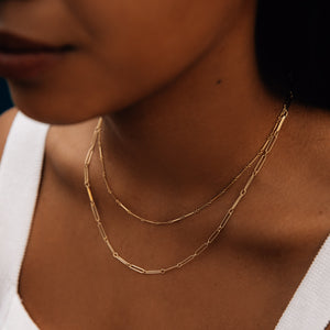 Model wearing the 14k gold long chain link necklace 