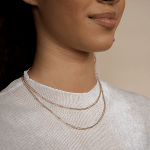 Model wearing the 14k gold long chain link necklace 