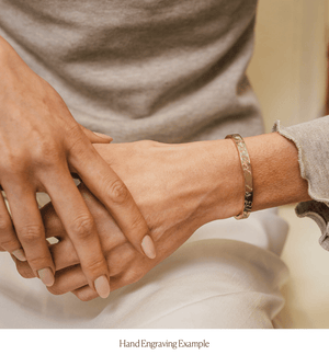 Model wearing 14k solid gold hand engraved cuff bracelet